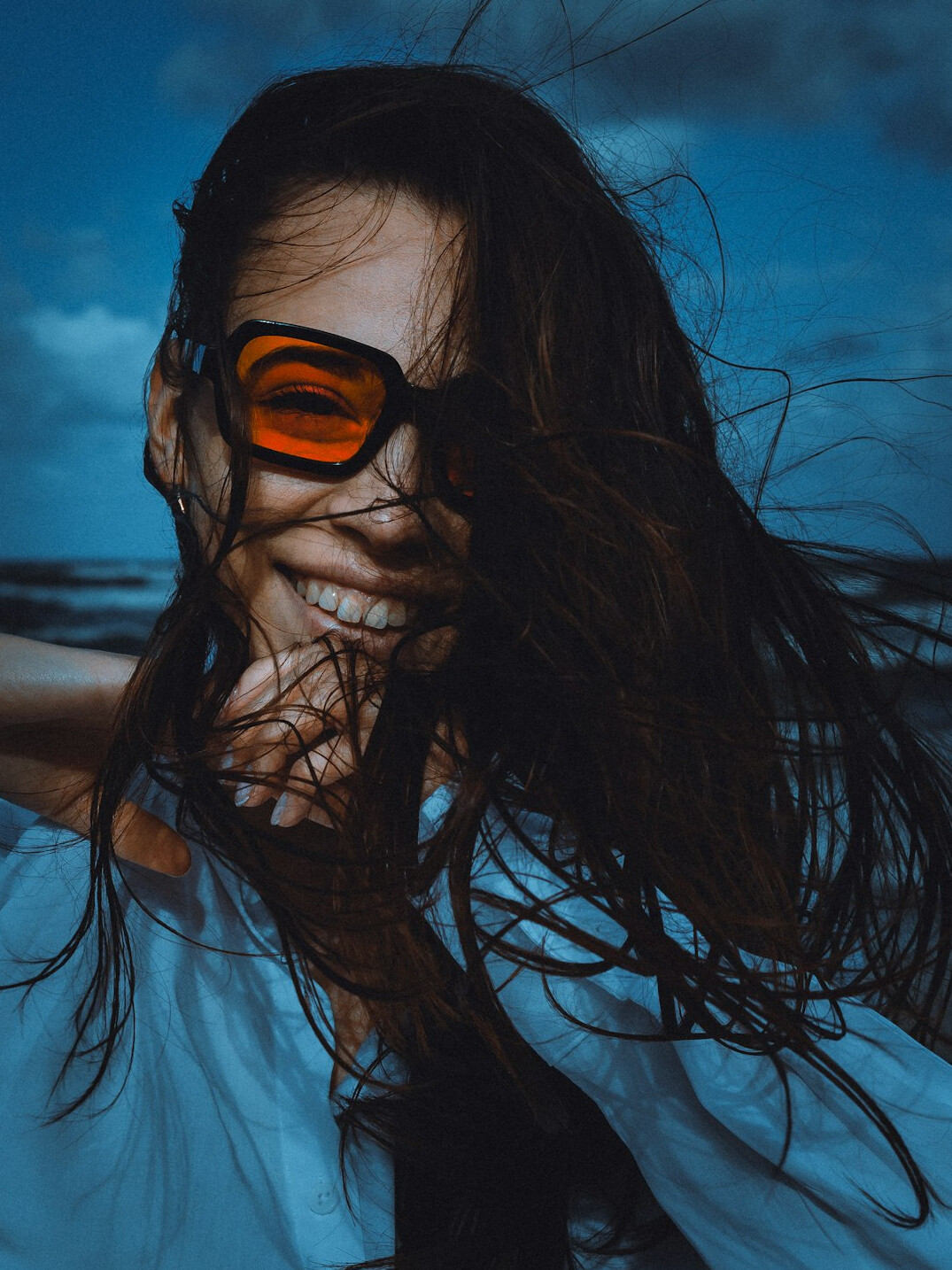 Portrait of a woman with long hair smiling